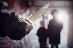 Criminal with knife weapon